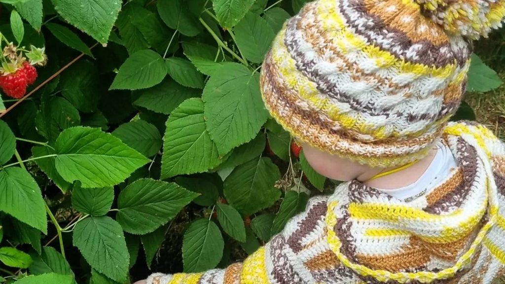 Boy near a bush