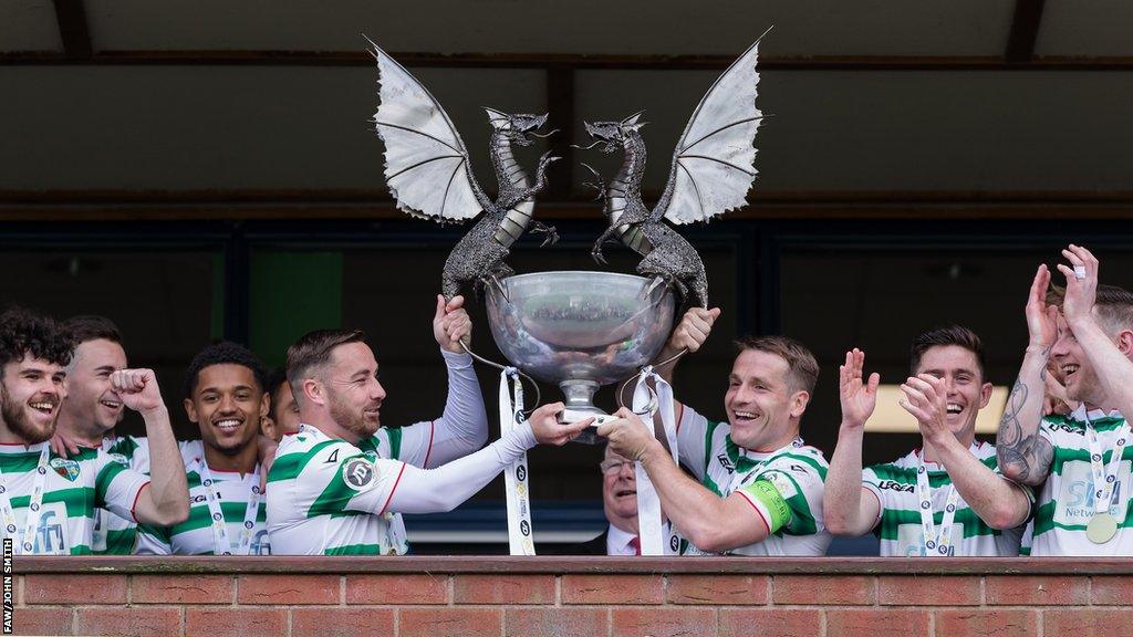 The New Saints players celebrate with the Cymru Premier trophy