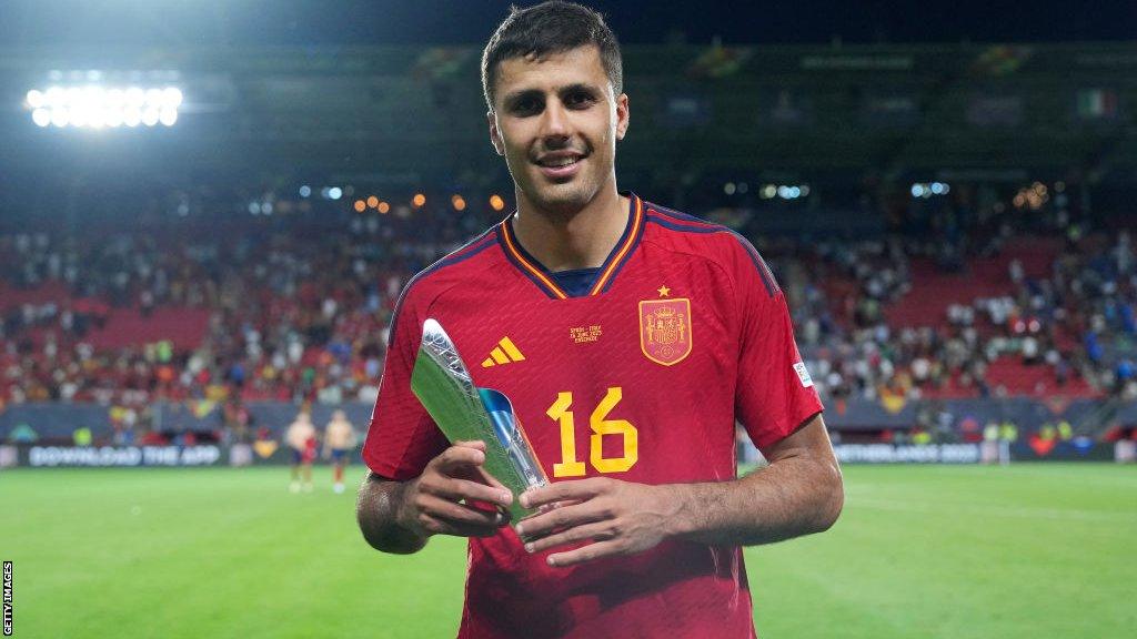 Rodri with player of the match trophy