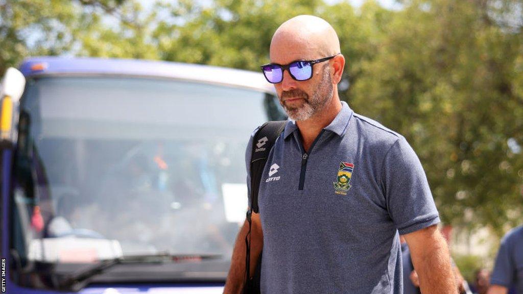 South Africa head coach Rob Walter walks in from the team bus