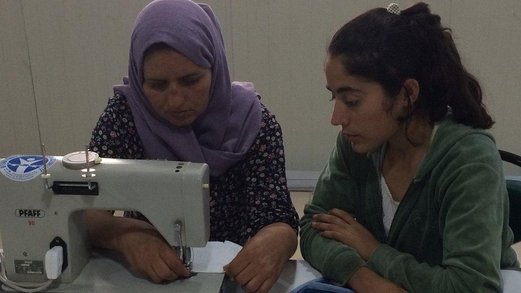 Two women sewing