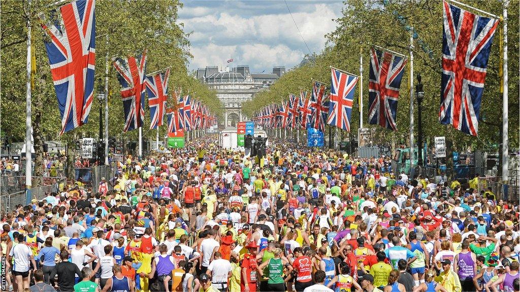 Runners following the London Marathon finish on the mall