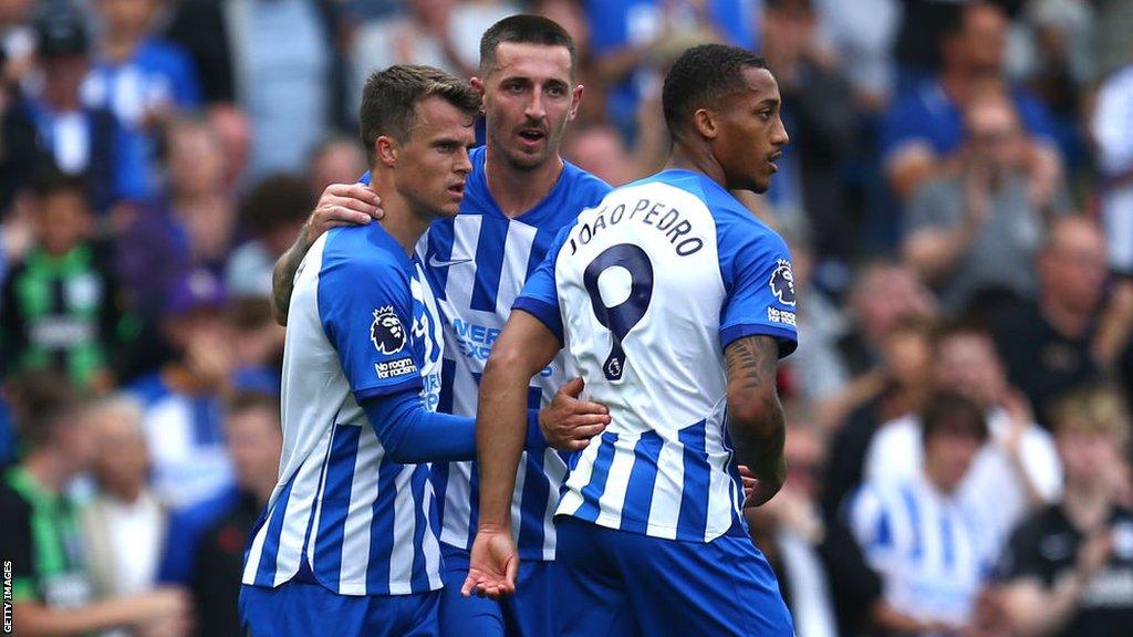 Brighton players celebrate a goal against Luton in August