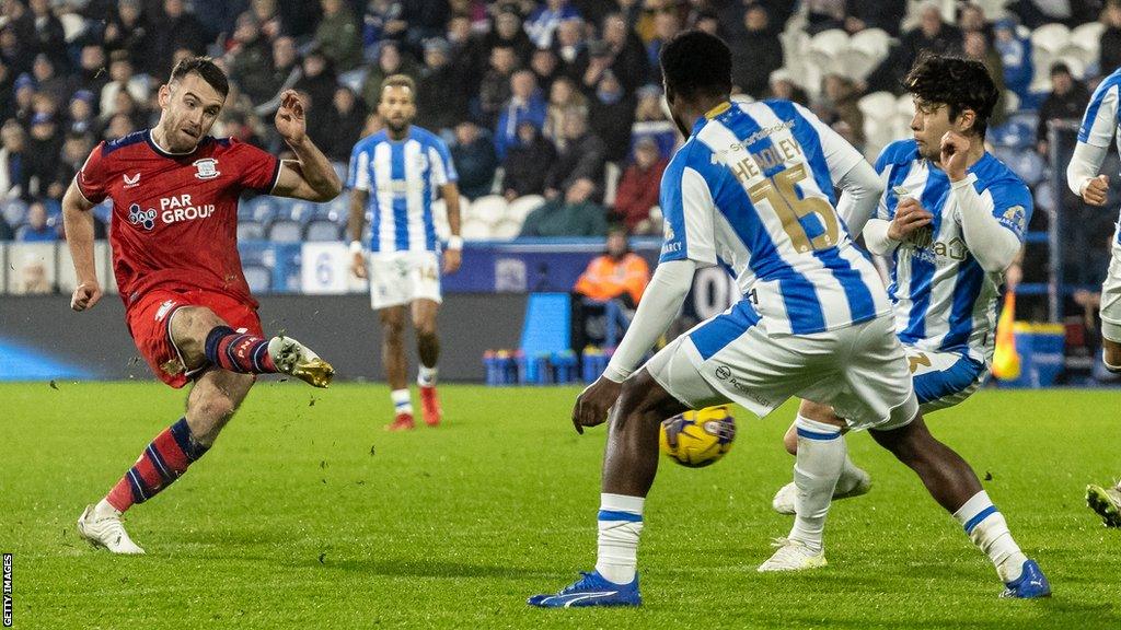 Preston North End's Ben Whiteman (left) scores his side's third goal during the Championship match between Huddersfield Town and Preston North End