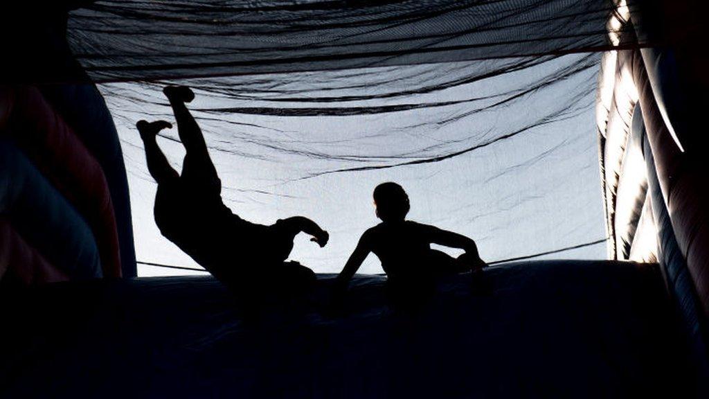 people on a bouncy castle