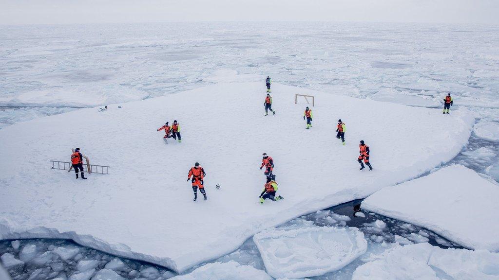 Scientists play sport on the ice in the Arctic