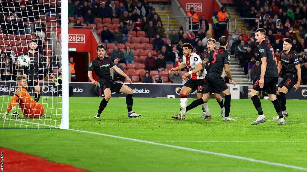 Che Adams (centre) scores Southampton's second goal against Lincoln City in the EFL Cup