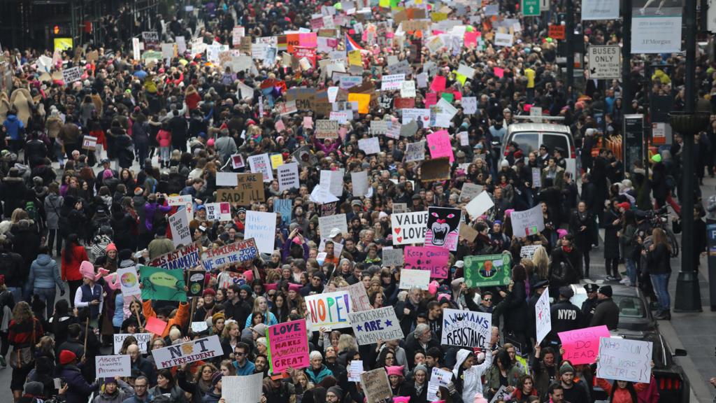 Thousands of people march on 42nd street in New York City