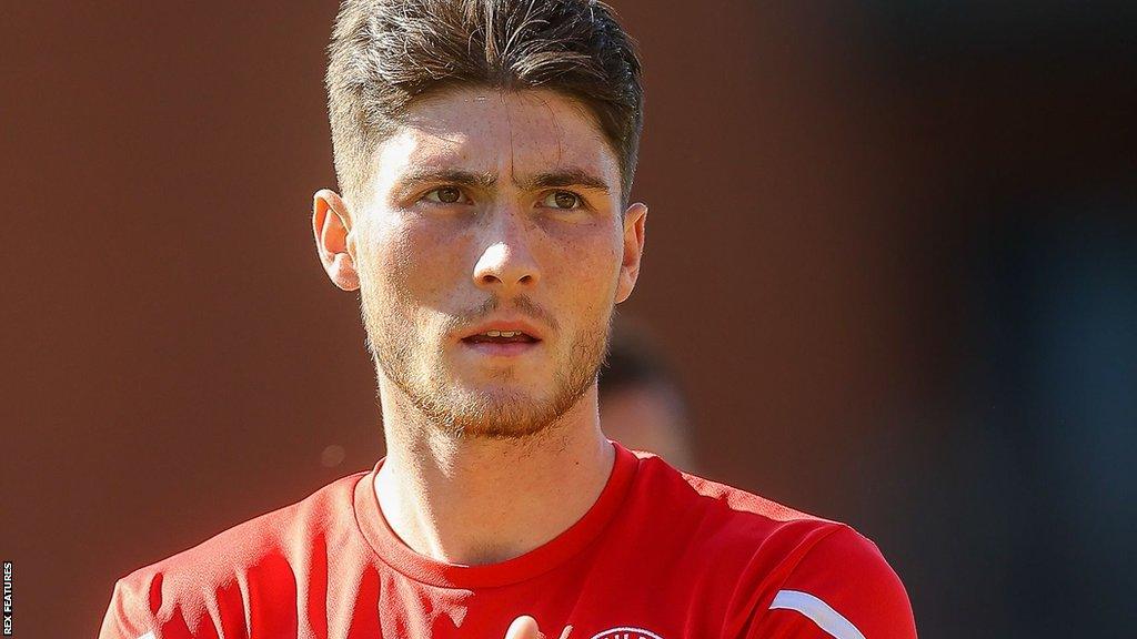 Walsall midfielder Jack Earing warming up