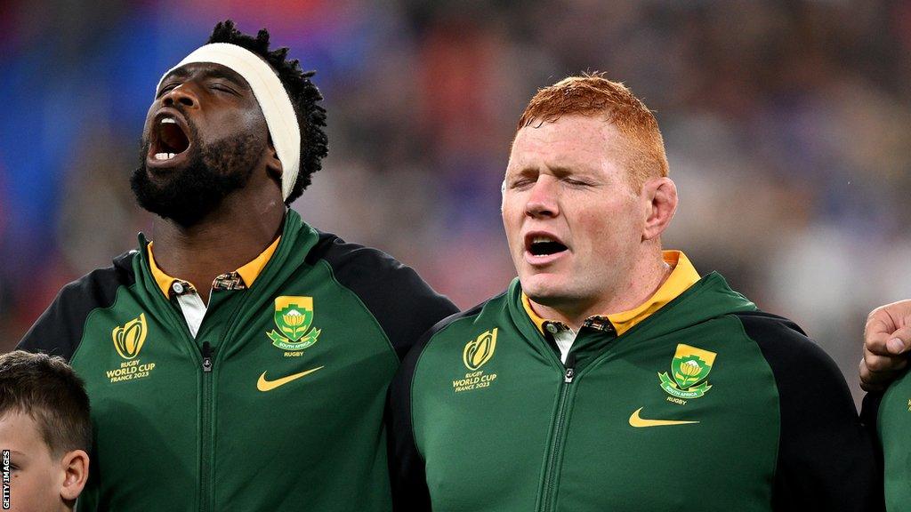 Siya Kolisi and Steven Kitshoff sing the South African national anthem before facing France in the World Cup quarter-final