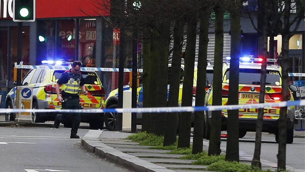 Police officers at the scene in London after a man was shot and killed by armed police, 2 February 2020