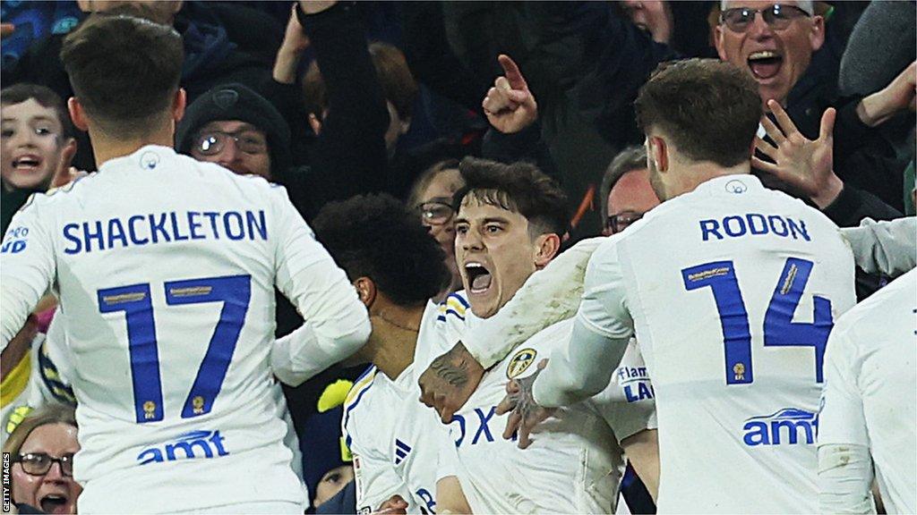 Daniel James being mobbed by Leeds team-mates after scoring