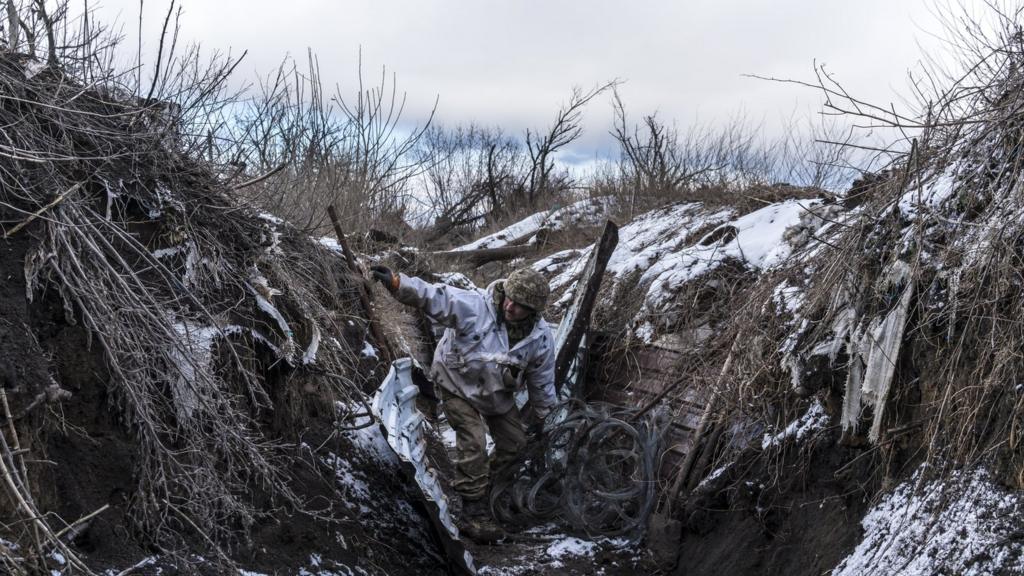 A Ukrainian soldier with the 56th Brigade in a trench on the front line on January 18, 2022 in Pisky, Ukraine.