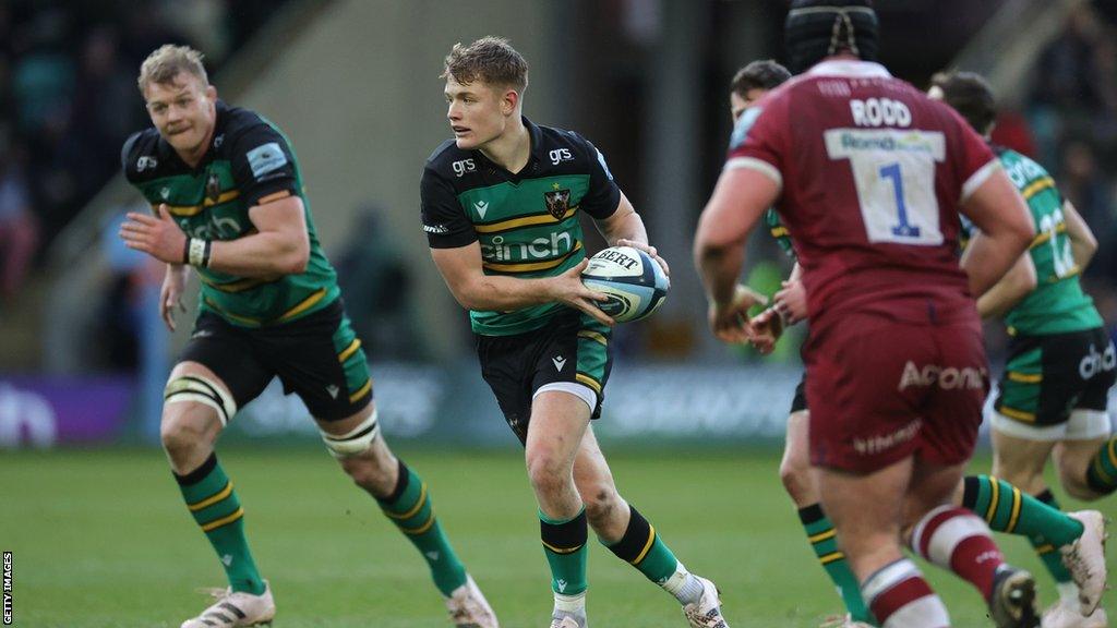 Fin Smith with the ball for Northampton