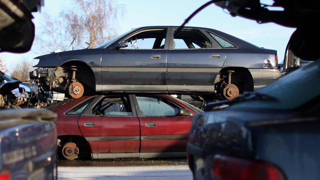 Cars piled at a scrap yard