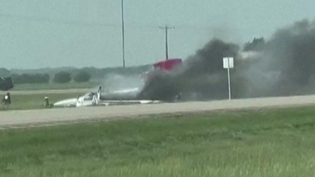 Smoke billows out of a vehicle that has come off the road