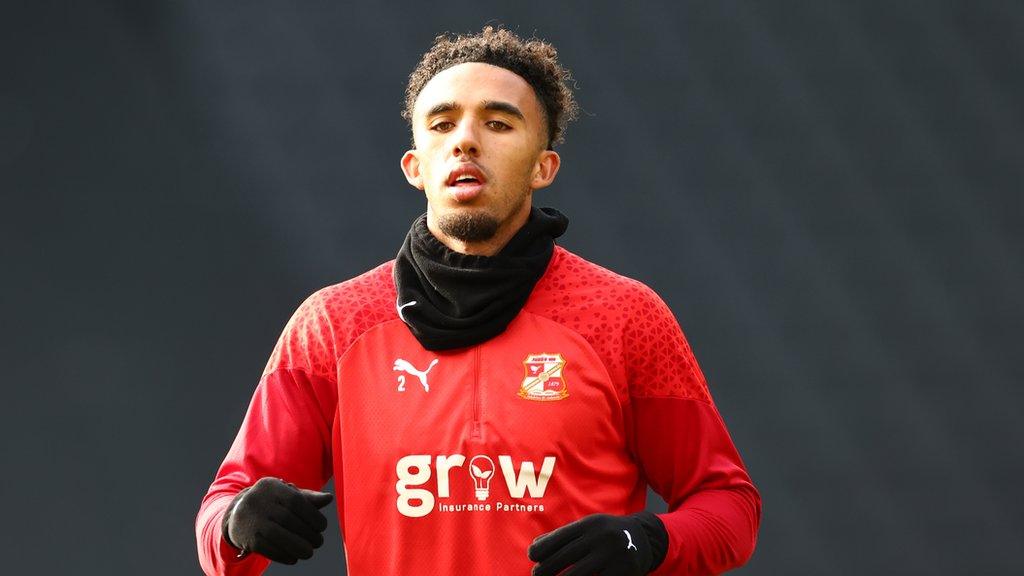 Remeao Hutton during a pre-match warm-up for Swindon