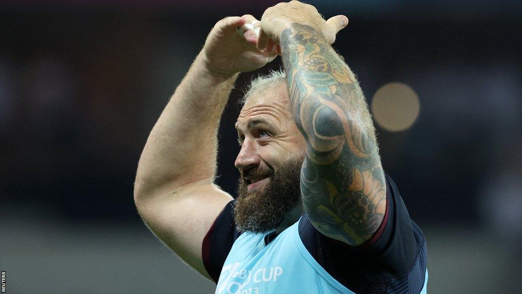 Joe Marler points to his head