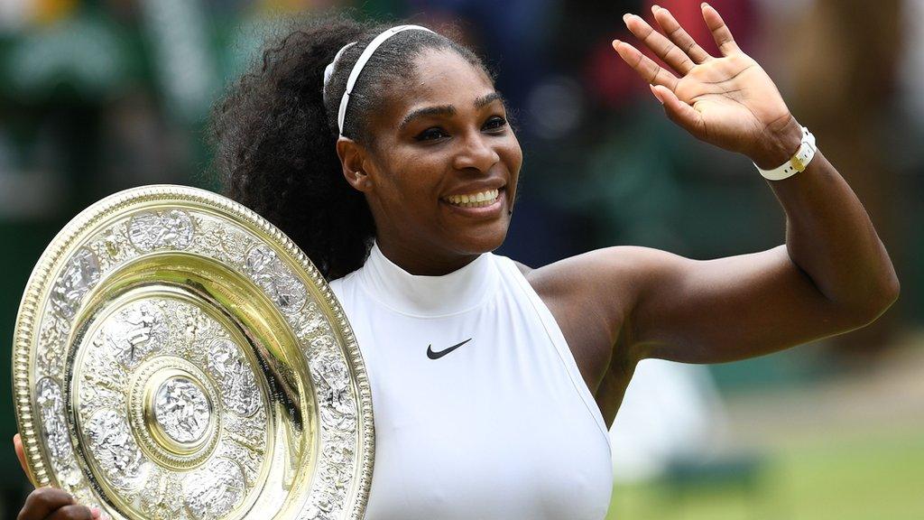 Serena Williams holding Wimbledon trophy