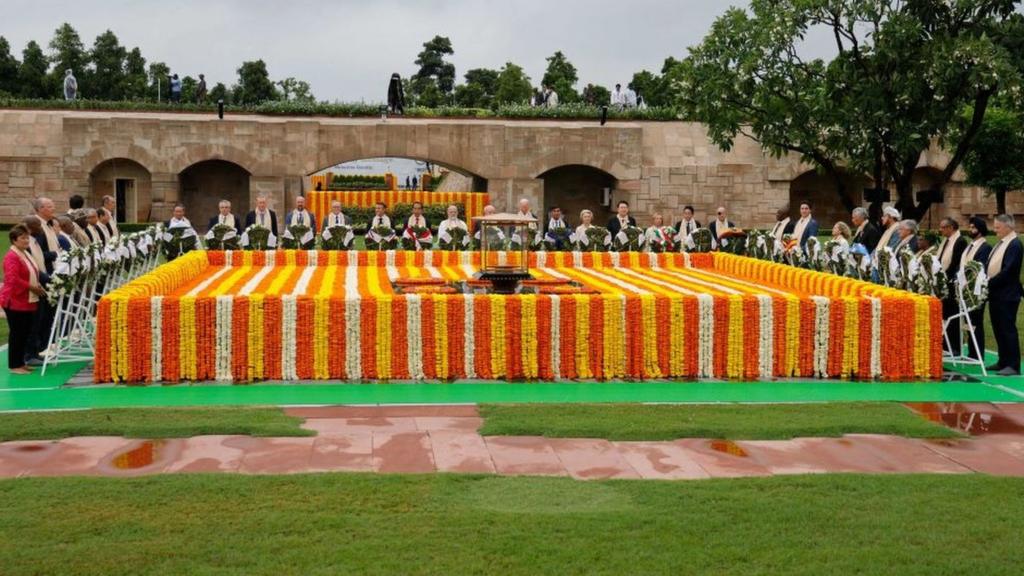 India's Prime Minister Narendra Modi (C) along with world leaders pay respect at the Mahatma Gandhi memorial at Raj Ghat on the sidelines of the G20 summit in New Delhi on September 10, 2023.