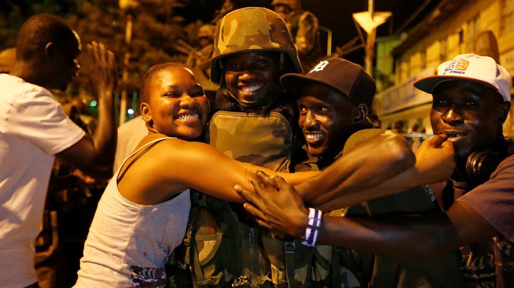 People celebrate the arrival of the regional ECOWAS force in Banjul, Gambia 22 January, 2017.