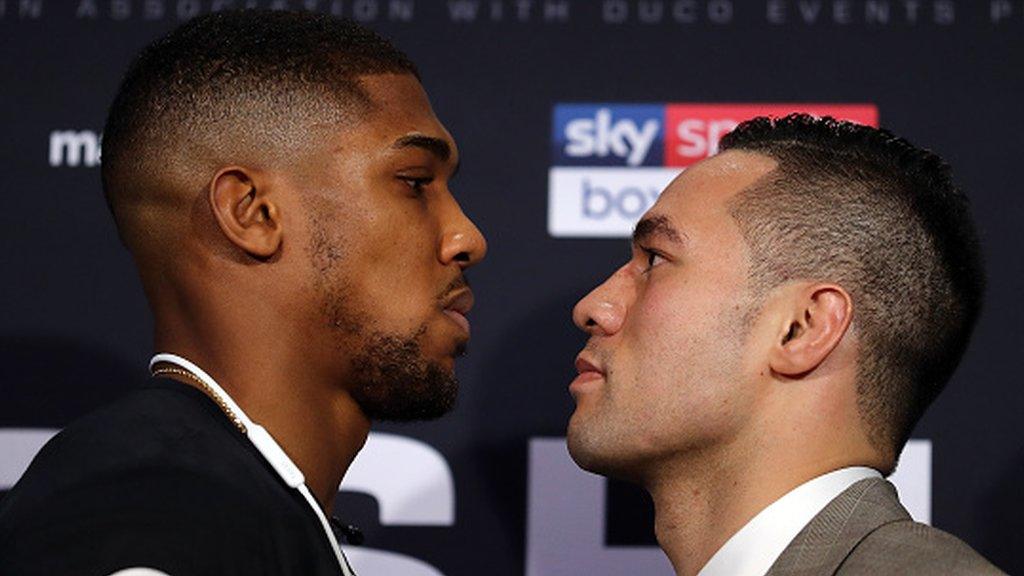 Anthony Joshua (left) stares at opponent Joseph Parker