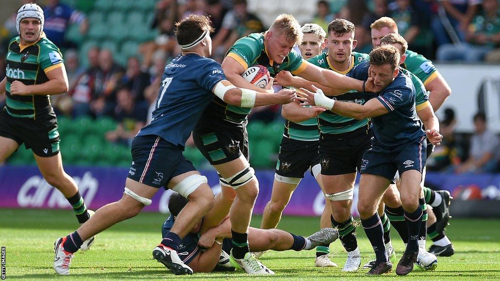 Tom Pearson (centre) forces his way through the Doncaster defence with the ball in hand