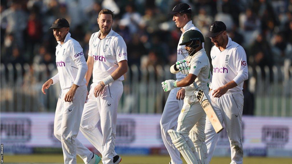 Ollie Robinson (second left) playing for England in Pakistan