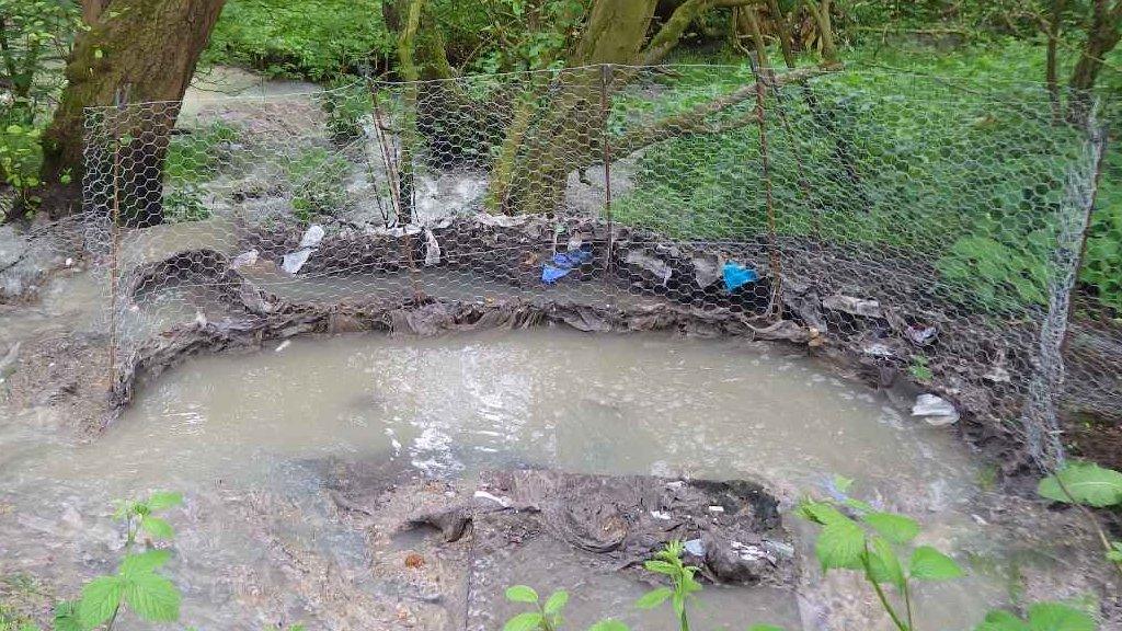 Sewage discharging from a manhole cover