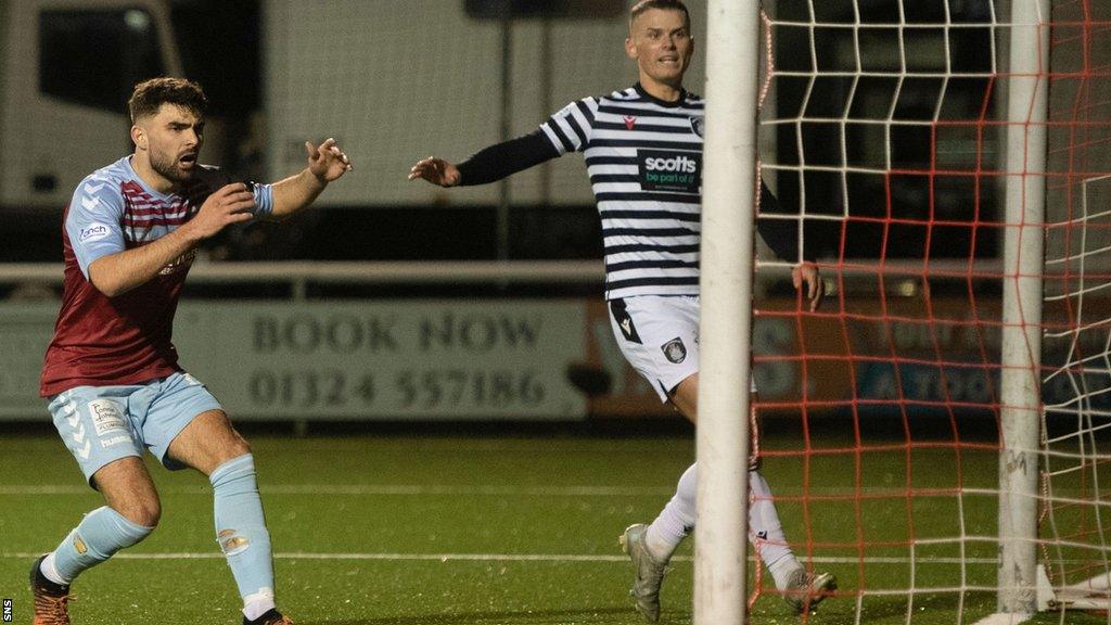 Nick McAllister watches on in horror as he scores an own-goal