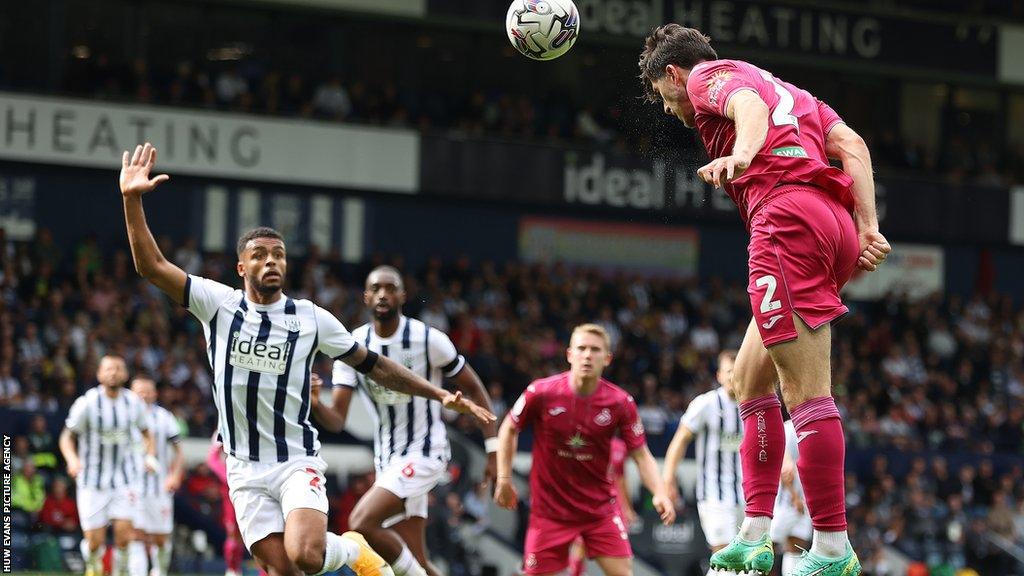 Swansea summer signing Josh Key heads for goal at West Brom