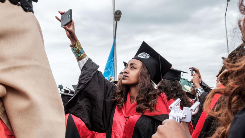 An Ethiopian graduate taking a selfie