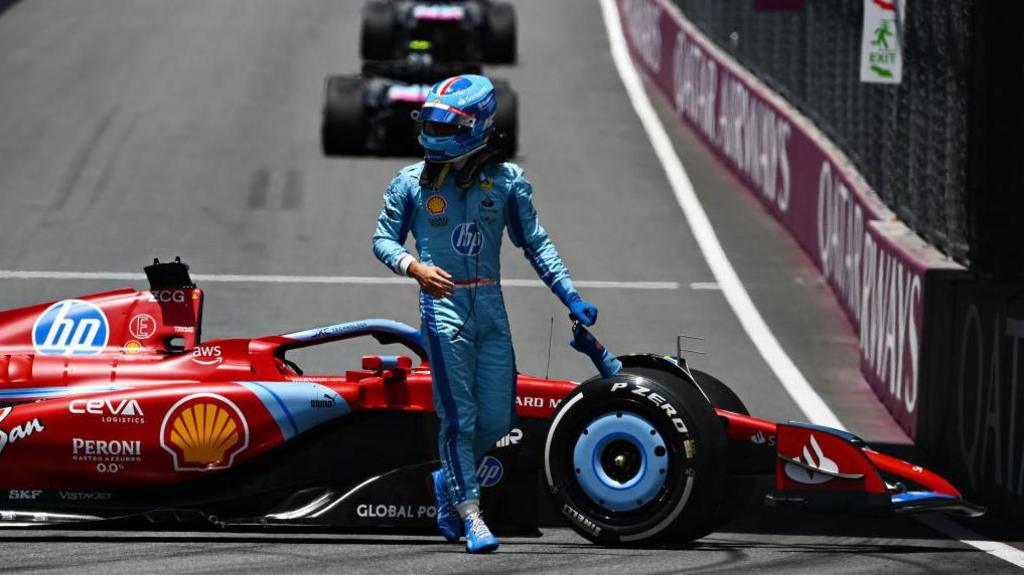 Ferrari's Charles Leclerc gets out of his car during first practice in Miami