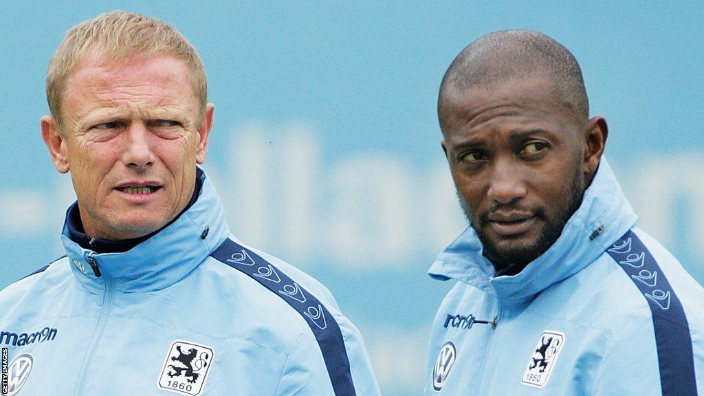 Torsten Frohling, head coach of football team 1860 Munich, with his former assistant coach Collin Benjamin (right)