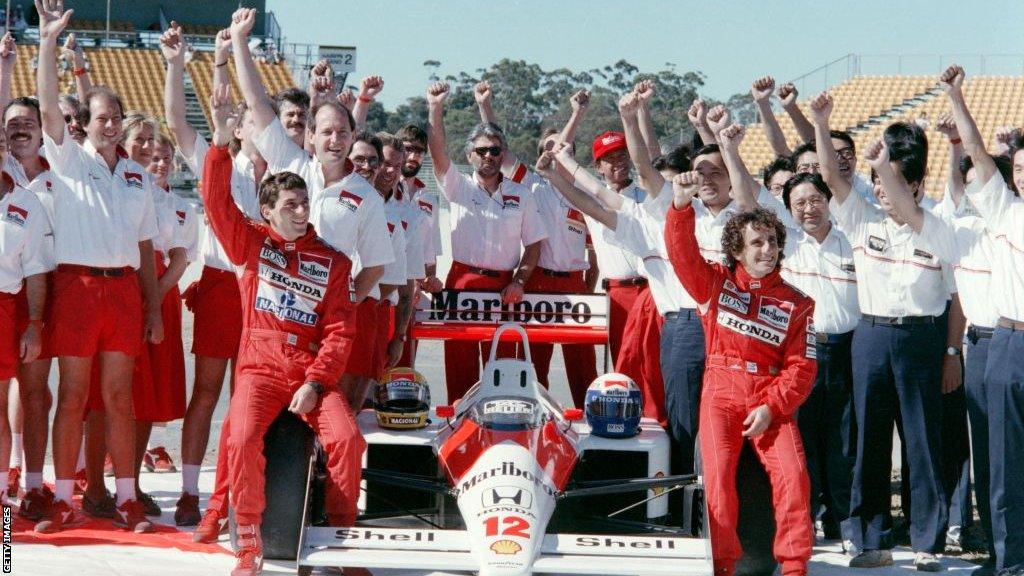 McLaren team, featuring Ayrton Senna and Alain Prost, celebrate their success in the 1988 season