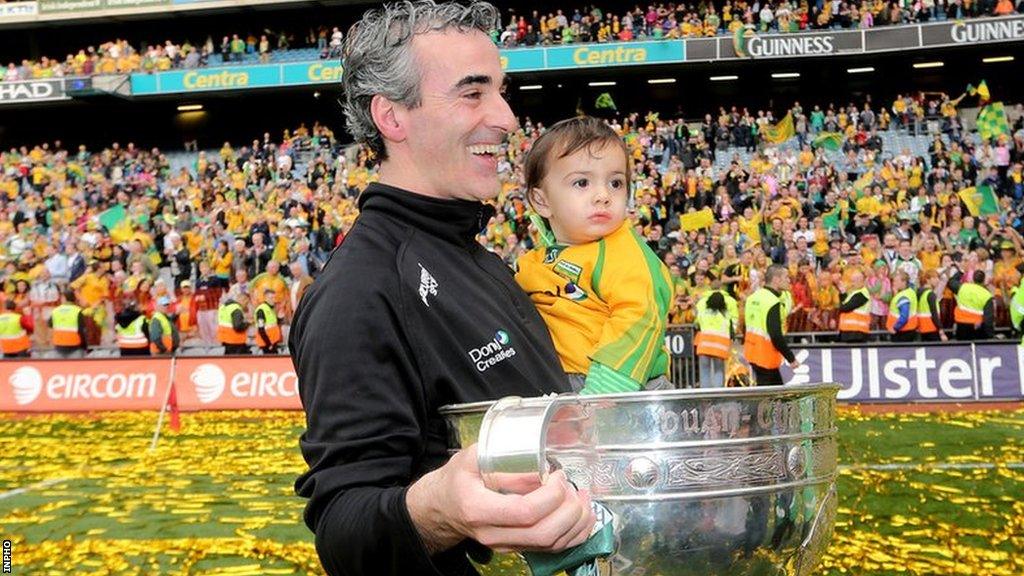 Jim McGuinness holds his son Jim and the Sam Maguire Cup after Donegal's All-Ireland Final triumph over Mayo in 2012