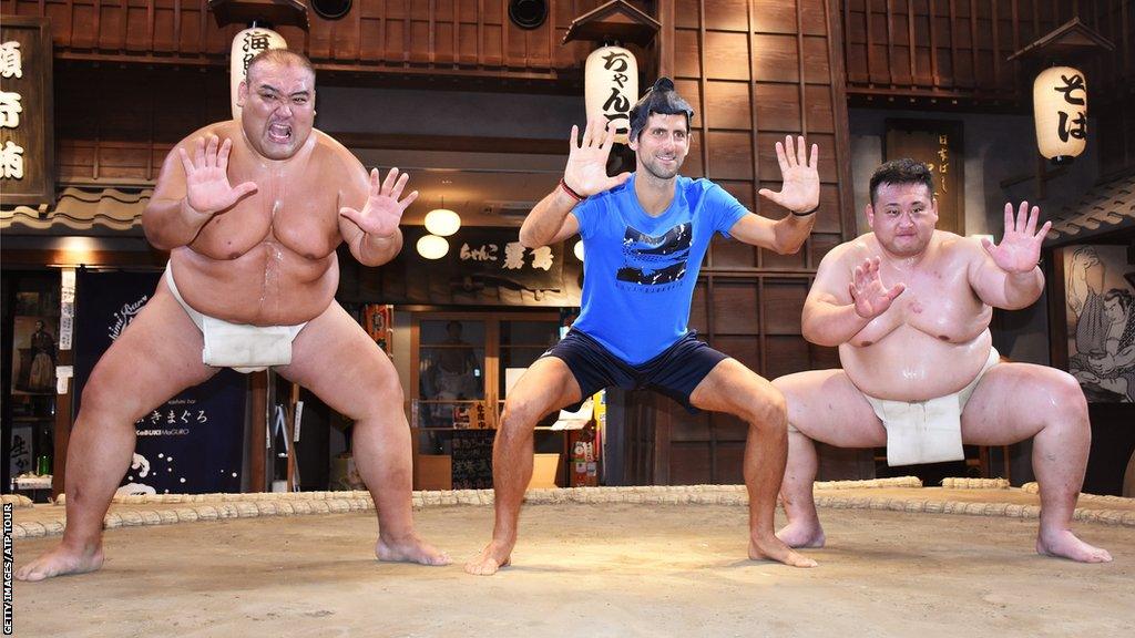 Tennis number one Novak Djokovic took part in a sumo warm-up during a visit to Japan in 2019