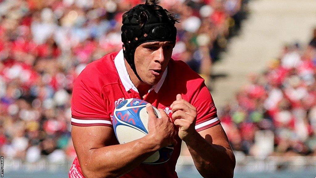 Dafydd Jenkins runs with the ball