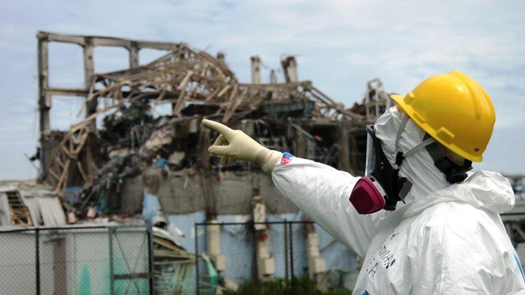 IAEA fact-finding team leader Mike Weightman examines Reactor Unit 3 at the Fukushima Daiichi Nuclear Power Plant