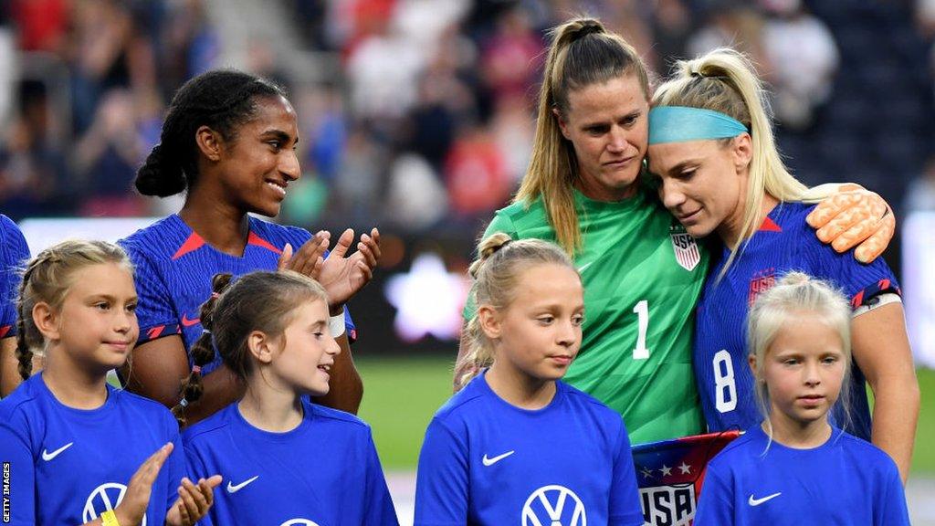 Julie Ertz hugs goalkeeper Alyssa Naeher before the start of her final match