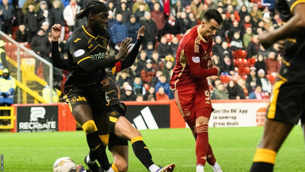 Aberdeen's Bojan Miovski scores to make it 2-1 during a cinch Premiership match between Aberdeen and Livingston at Pittodrie Stadium