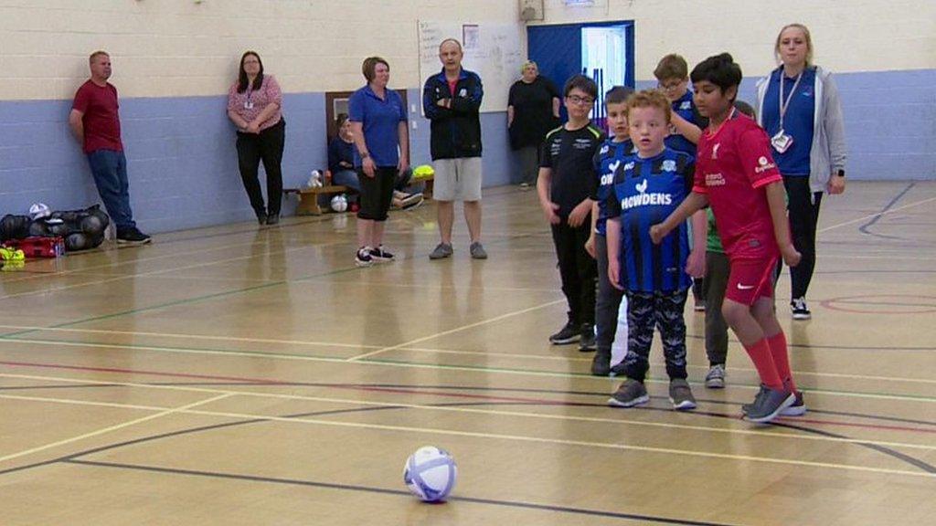 Children line up to take penalties