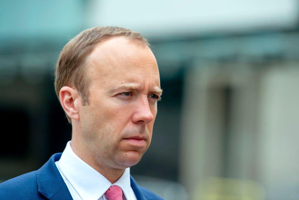 Matt Hancock, dressed in a blue suit, looks serious outside of BBC New Broadcasting house