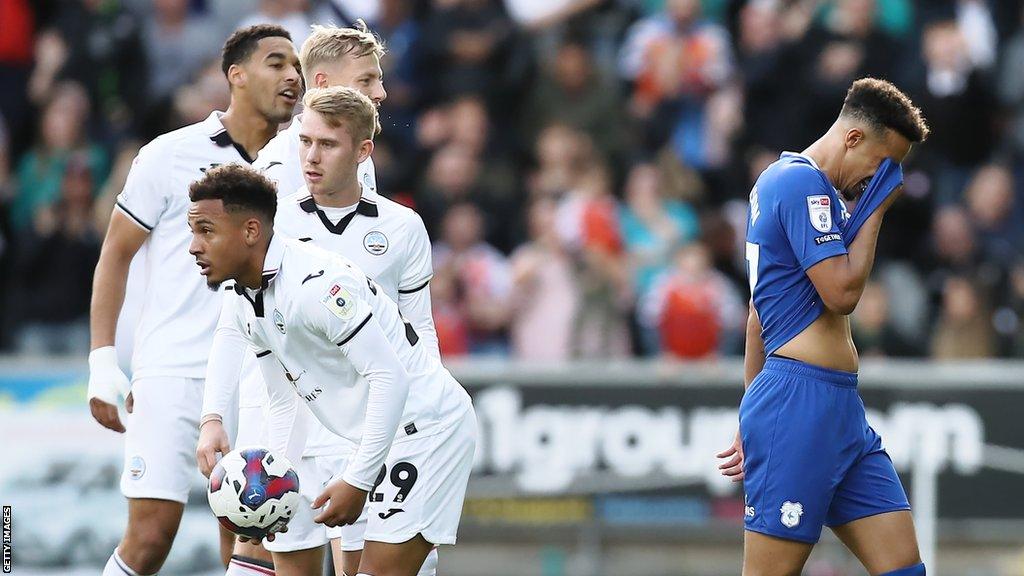 Callum Robinson trudges off after being sent off at Swansea earlier this season