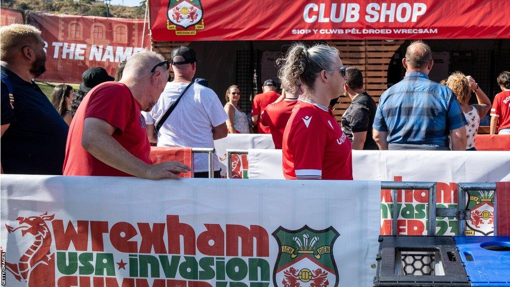 Fans queue at a Wrexham fan park in San Diego