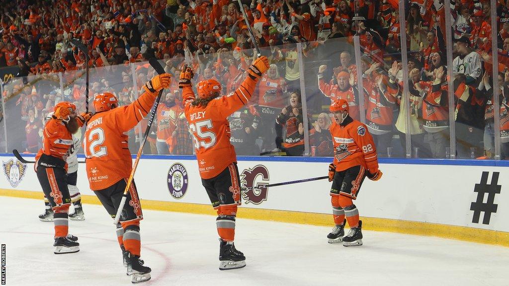 Sheffield Steelers players celebrate semi-final victory with their fans in Nottingham