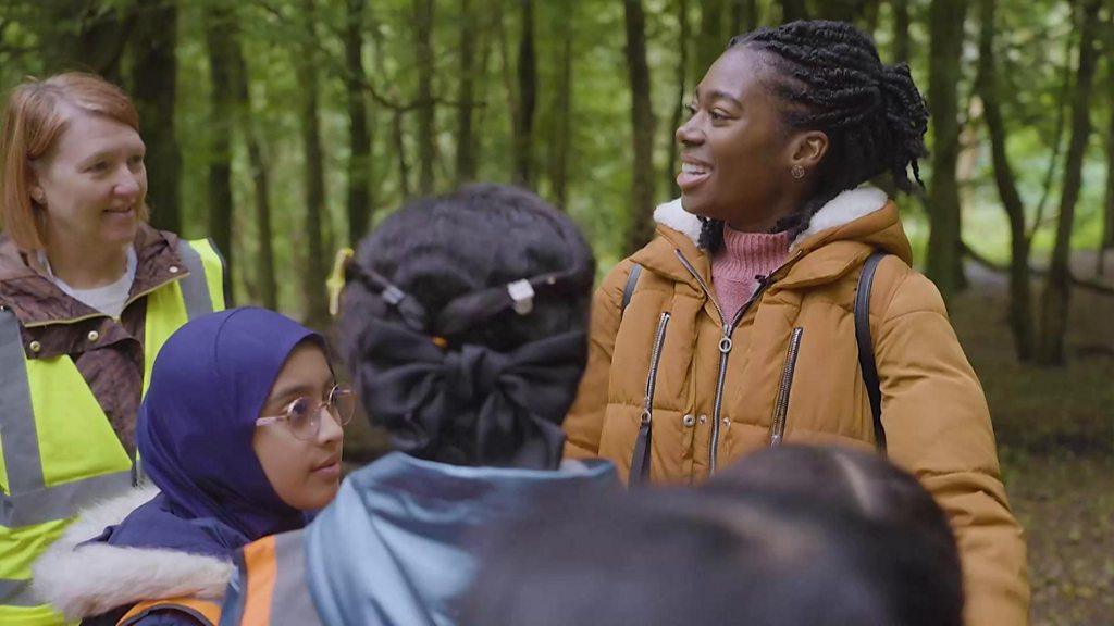 Shanequa joins pupils foraging for fungi in the forest