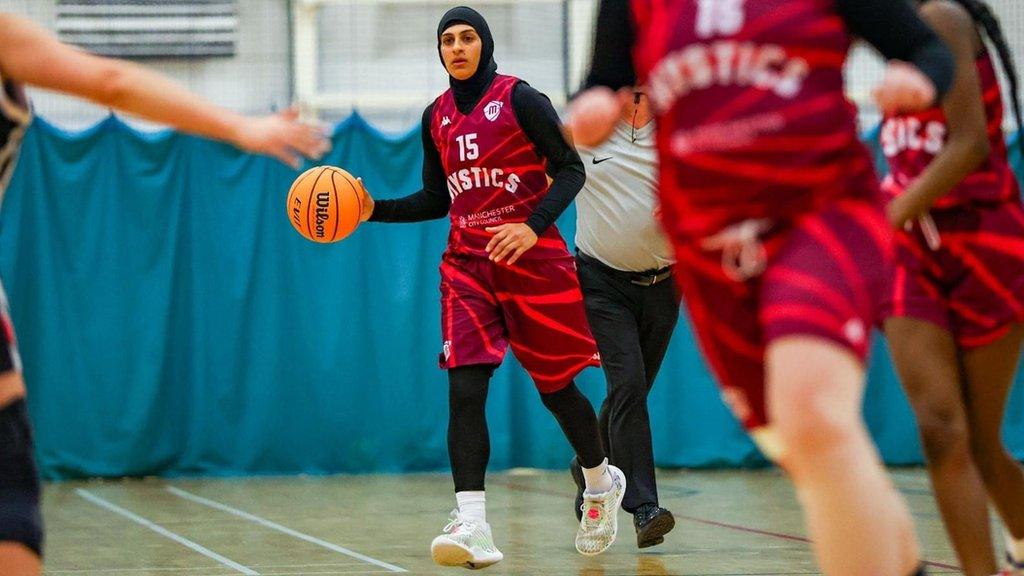 Rehana Khalil playing for the Manchester Mystics dribbling a basketball up the court