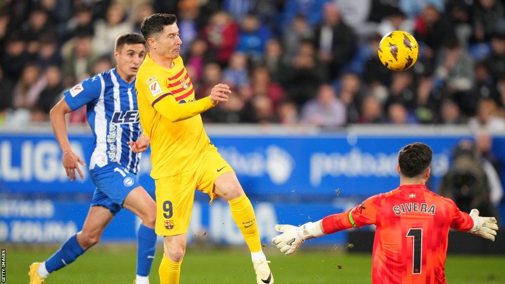 Robert Lewandowski scores the opening goal for Barcelona against Alaves