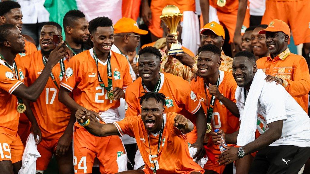 Ivory Coast players celebrate with the 2023 Africa Cup of Nations trophy